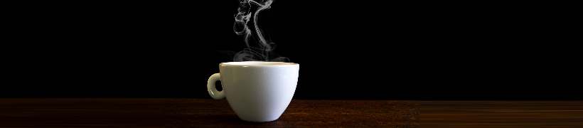 A steaming cup of coffee.