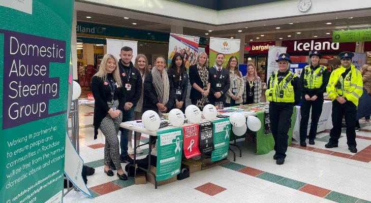 Council staff and police at a White Ribbon Day display at Rochdale Exchange Shopping Centre.