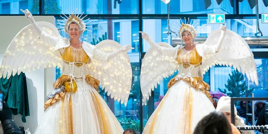 Performers dressed as angels performing at the Rochdale Christmas lights switch-on.