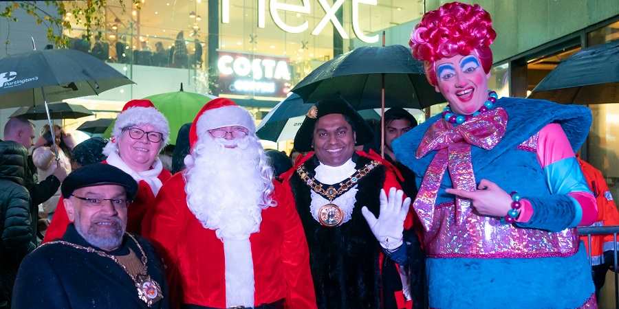 Consort Sultan Ali, councillor Janet Emsley, Father Christmas, mayor Ali Ahmed with Dame Dolly at Rochdale Riverside.